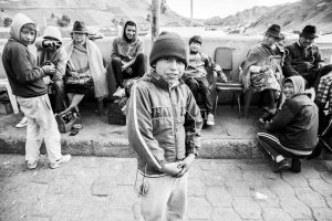This photo was taken in Ecuador at a market in the Andes in May.  Looking at their expressions, what story do you see here?